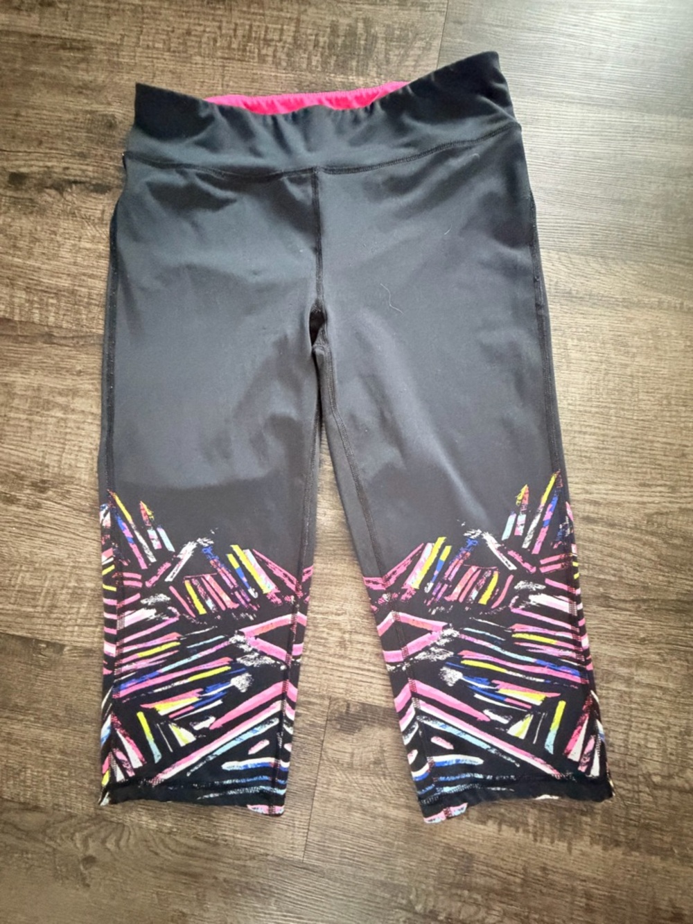 Black Capri Leggings with Pink Waistband and Multicolor Hem Design